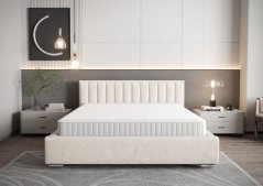 Moderná čalúnená posteľ s vertikálnym prešívaním na čele v krémovej farbe 180 x 200 cm