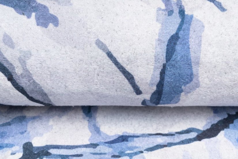 Semplice tappeto bianco e blu con motivo astratto