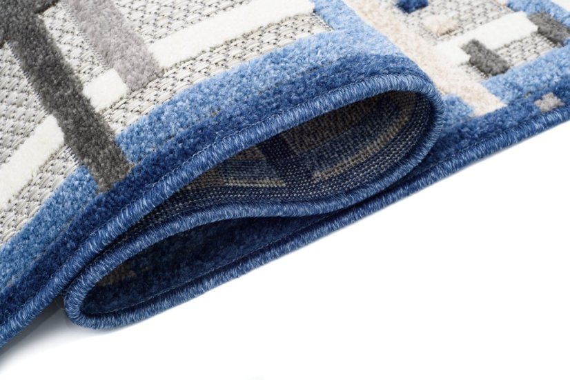 Grauer Terrassenteppich mit blauem Muster