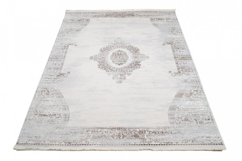 Dizajnový vintage koberec so vzorom v krémovej farbe