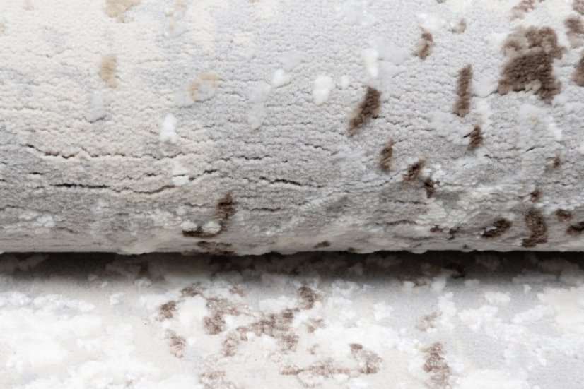 Beige-grauer Teppich im Vintage-Design