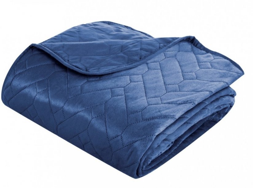 Jednobarevný přehoz na postel modré barvy s prošíváním