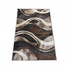 Оригинален килим с абстрактен десен в кафяв цвят