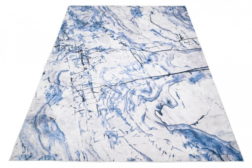 Semplice tappeto bianco e blu con motivo astratto