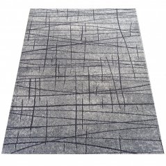 Moderner abstrakter grauer Teppich