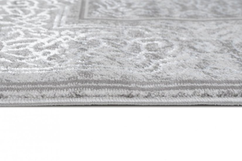 Esclusivo tappeto grigio con motivo orientale bianco