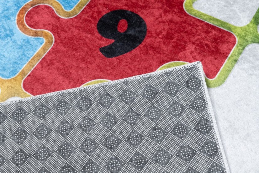 Kinderteppich mit buntem Puzzlemotiv