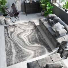Tappeto di design grigio scuro con motivo astratto