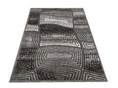 Moderner grauer Teppich mit abstraktem Motiv
