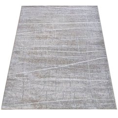 Beigefarbener Teppich mit minimalistischen Mustern 