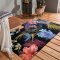 Luxuriöser schwarzer Teppich mit exotischem Blumenmotiv