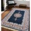 Луксозен син килим с красиви цветни детайли
