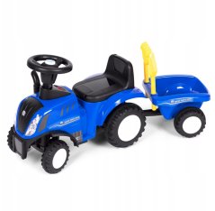 Modrý traktor NEW HOLLAND s vlečkou a náradim