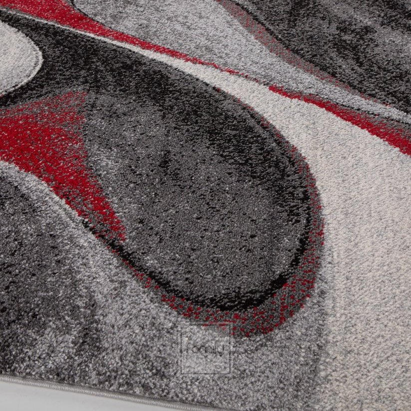 Dizajnerski crveni tepih s apstraktnim uzorkom