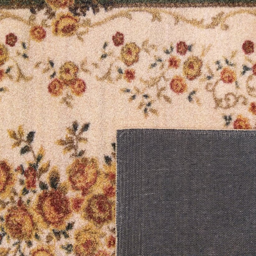 Zelený vintage koberec s květinovým motivem