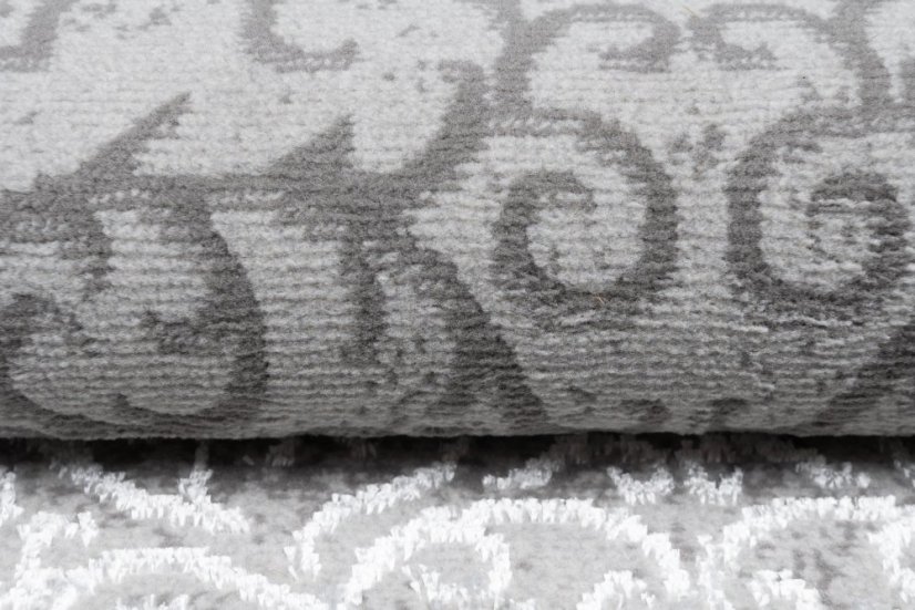 Esclusivo tappeto grigio con motivo orientale bianco