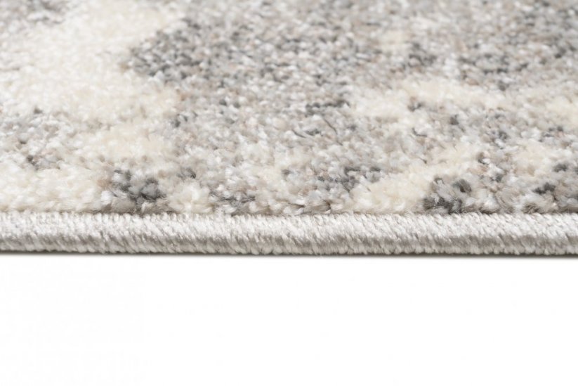 Krémový designový koberec s šedým abstraktním vzorem