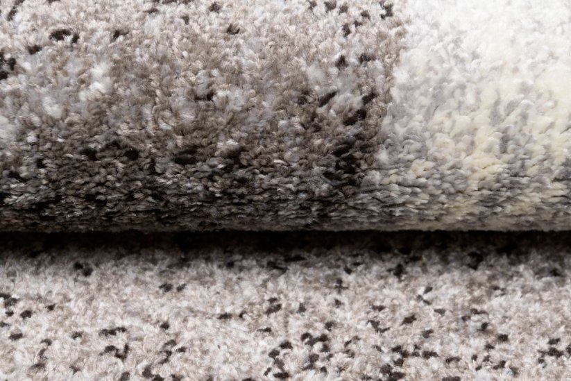 Moderner Teppich in Brauntönen mit abstraktem Muster