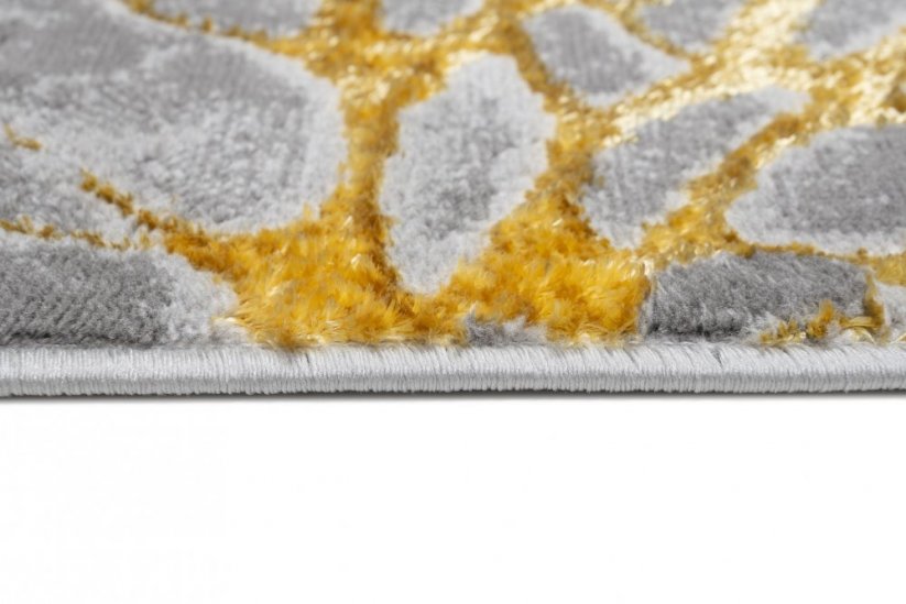 Опростен модерен килим в сиво със златен мотив