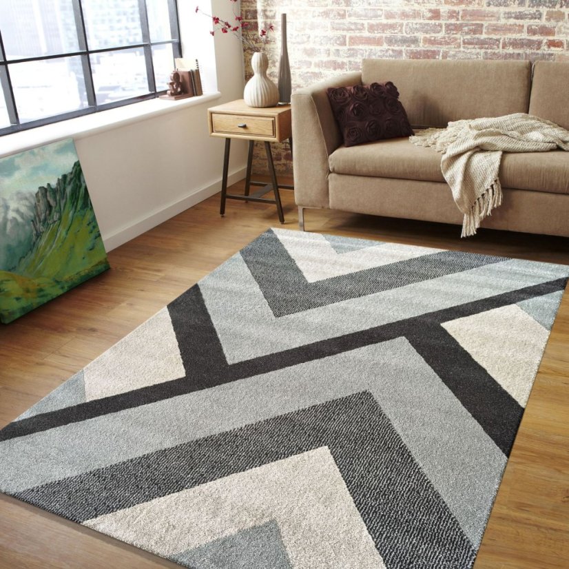 Moderný koberec s geometrickými vzormi v sivých farbách
