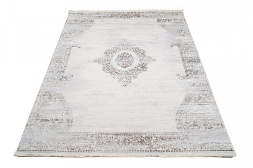 Dizajnový vintage koberec so vzorom v krémovej farbe