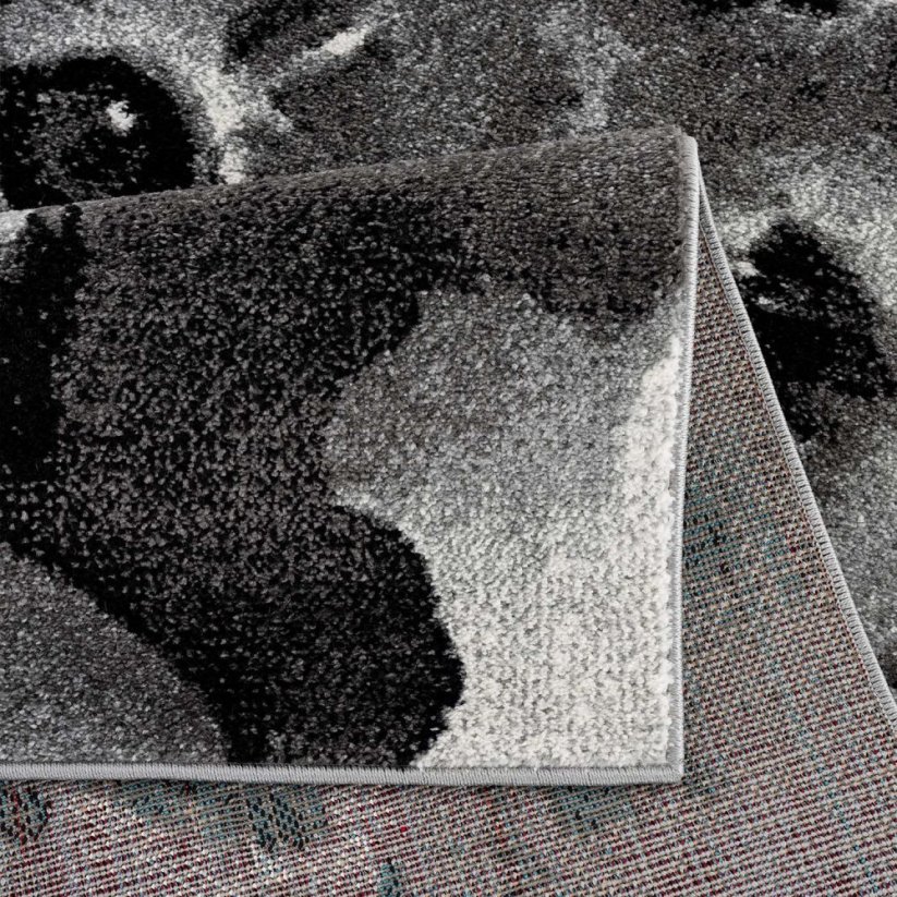 Kulatý koberec s motivem rozkošné lvíče šedé barvy