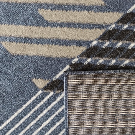 Tappeto di design in blu con strisce