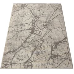 Béžový koberec s abstraktním vzorem