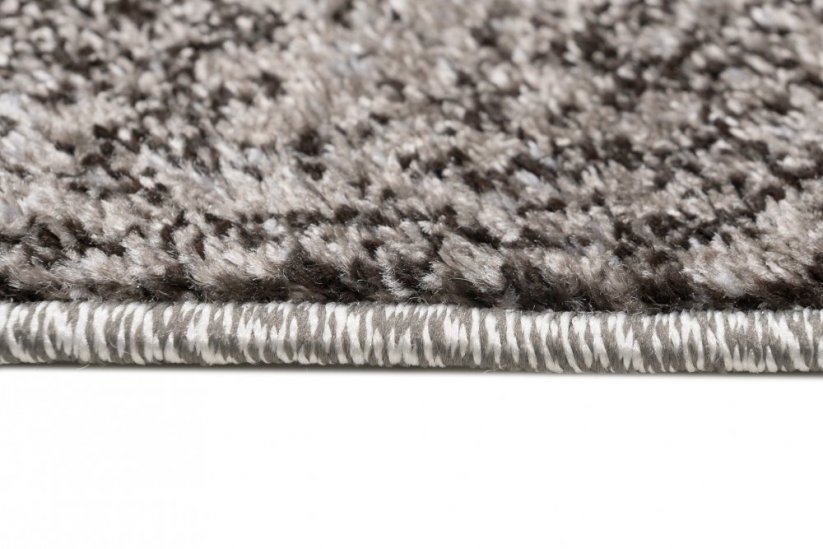 Moderner Teppich in Brauntönen mit abstraktem Muster