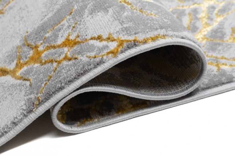 Schlichter moderner Teppich in Grau mit Goldmotiv