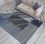 Tappeto di design in blu con strisce