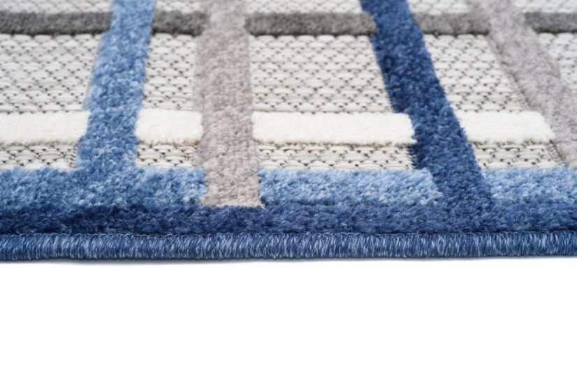 Grauer Terrassenteppich mit blauem Muster