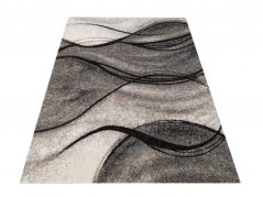 Moderní šedý koberec s abstraktním motivem