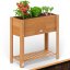 Aiuola rialzata da giardino in legno di acacia con vano portaoggetti 68 × 30 × 75 cm