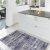 Tappeto grigio scuro con nappe