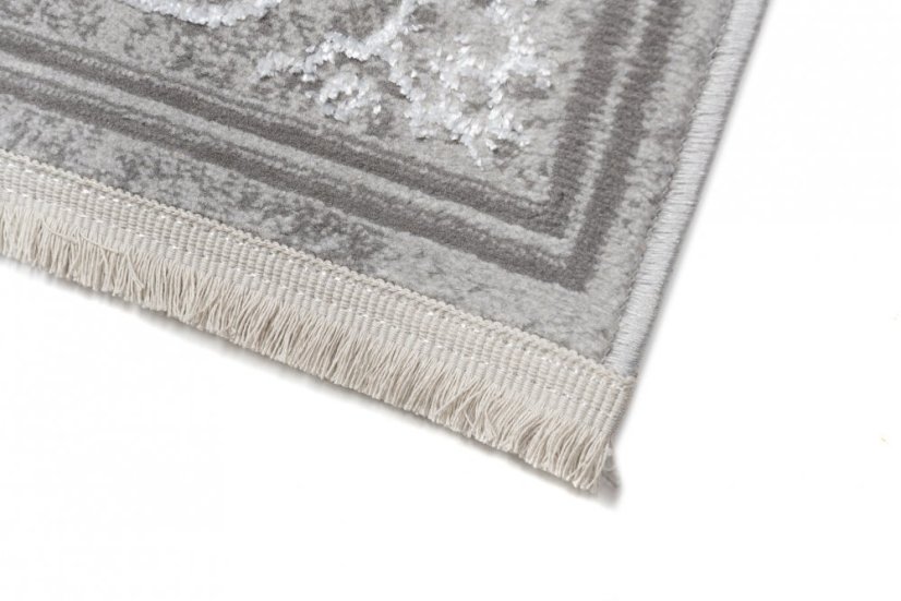 Esclusivo tappeto grigio con motivo orientale bianco