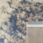 Schöner moderner Teppich in Beige mit blauen Details