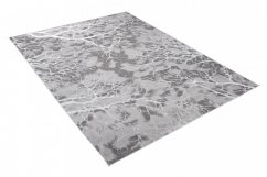 Schlichter moderner Teppich in Grau mit weißem Motiv