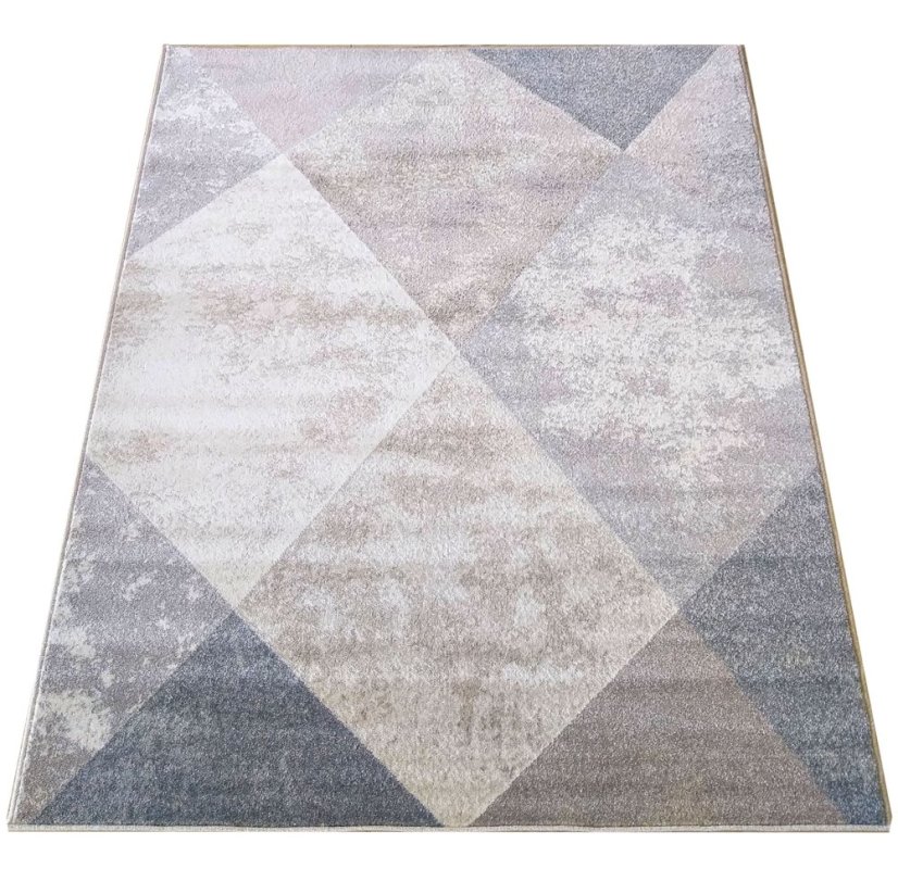 Beigefarbener Teppich mit modernem geometrischem Muster