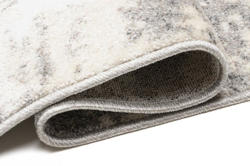Tepih krem dizajna sa sivim apstraktnim uzorkom