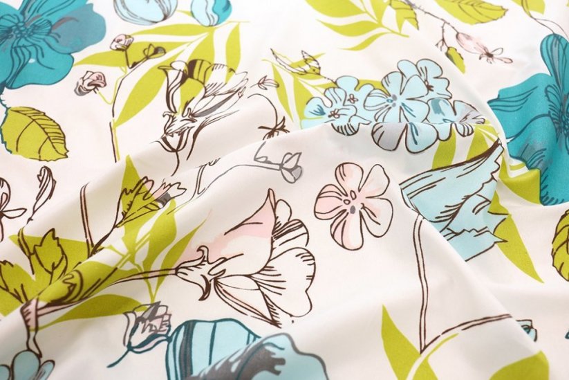 Oboustranný šedý přehoz na postel s barevným motivem květů