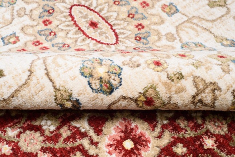 Kulatý vintage koberec krémové barvy