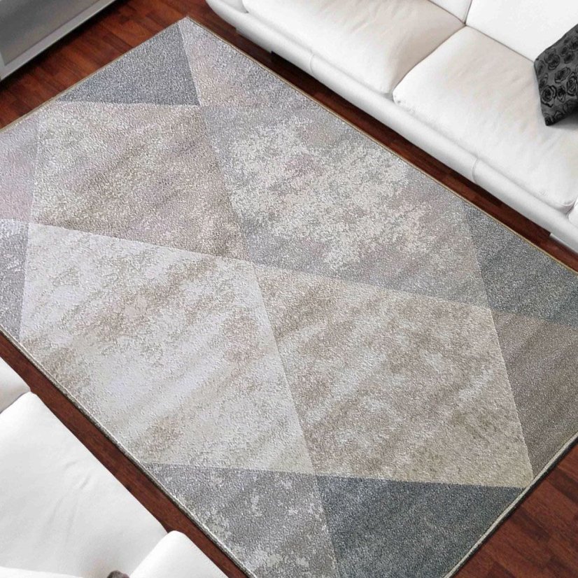 Beigefarbener Teppich mit modernem geometrischem Muster