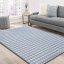 Štýlový koberec sivej farby do spálne