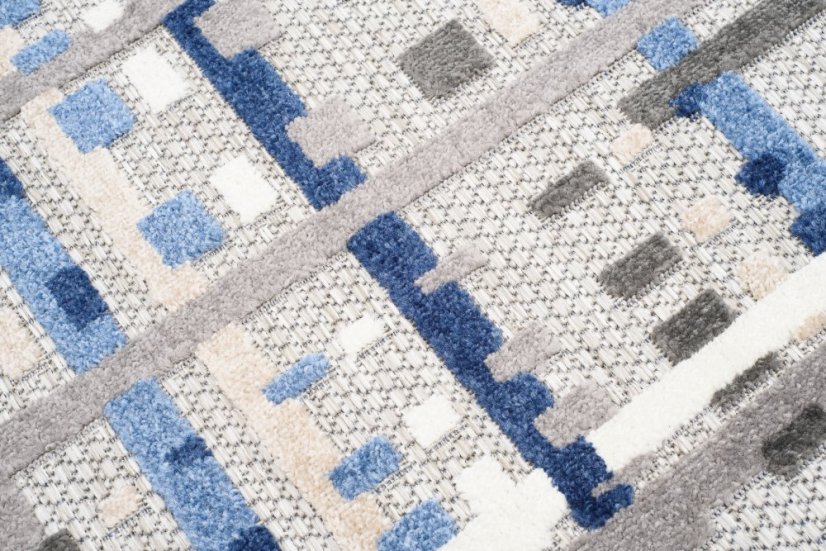 Grauer Terrassenteppich mit blauem Muster