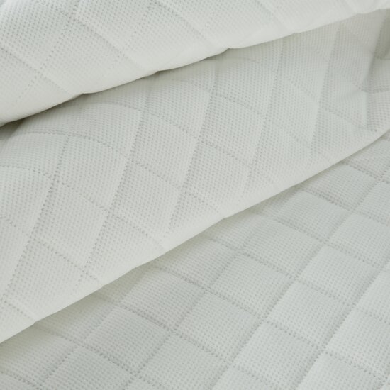 Velvet bedspread quilted in geometric pattern
