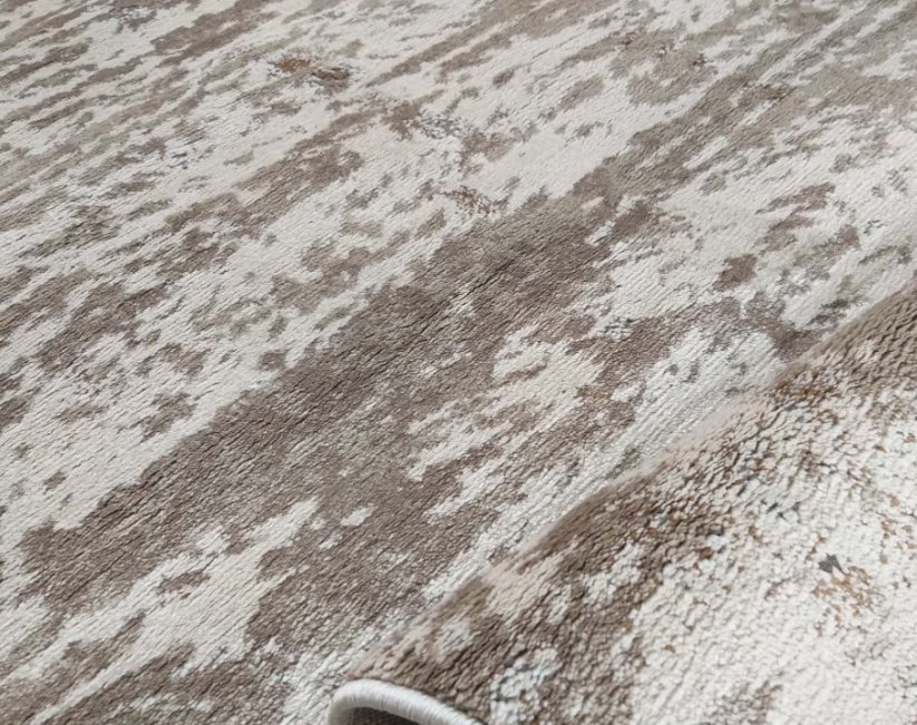 Béžový moderný koberec s jemným vozorom