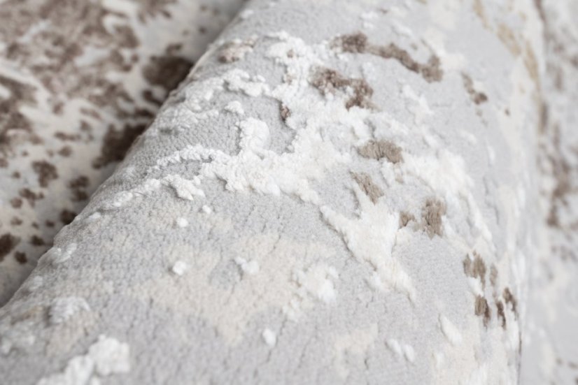 Beige-grauer Teppich im Vintage-Design