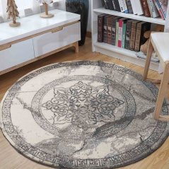 Okrúhly koberec so vzorom mandaly sivej farby