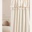Svetlo krem zavesa Astoria s čopki za žične zanke 140 x 280 cm